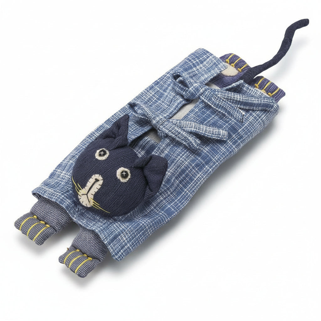 Close-up of the flax-filled pillow with removable clothing and stitched details