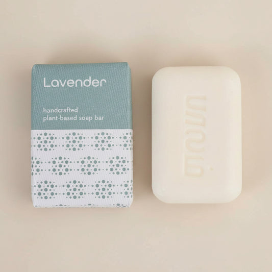 Lavender handcrafted plant-based soap bar with packaging on a white background