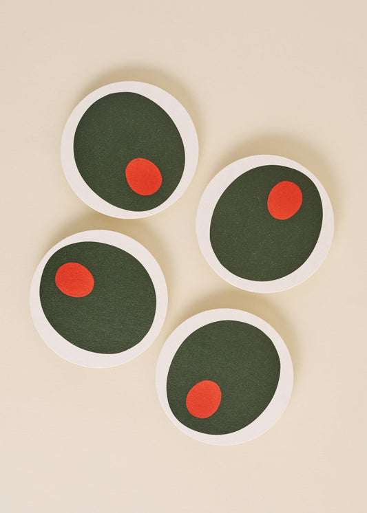 Set of four olive coasters displayed on a white background