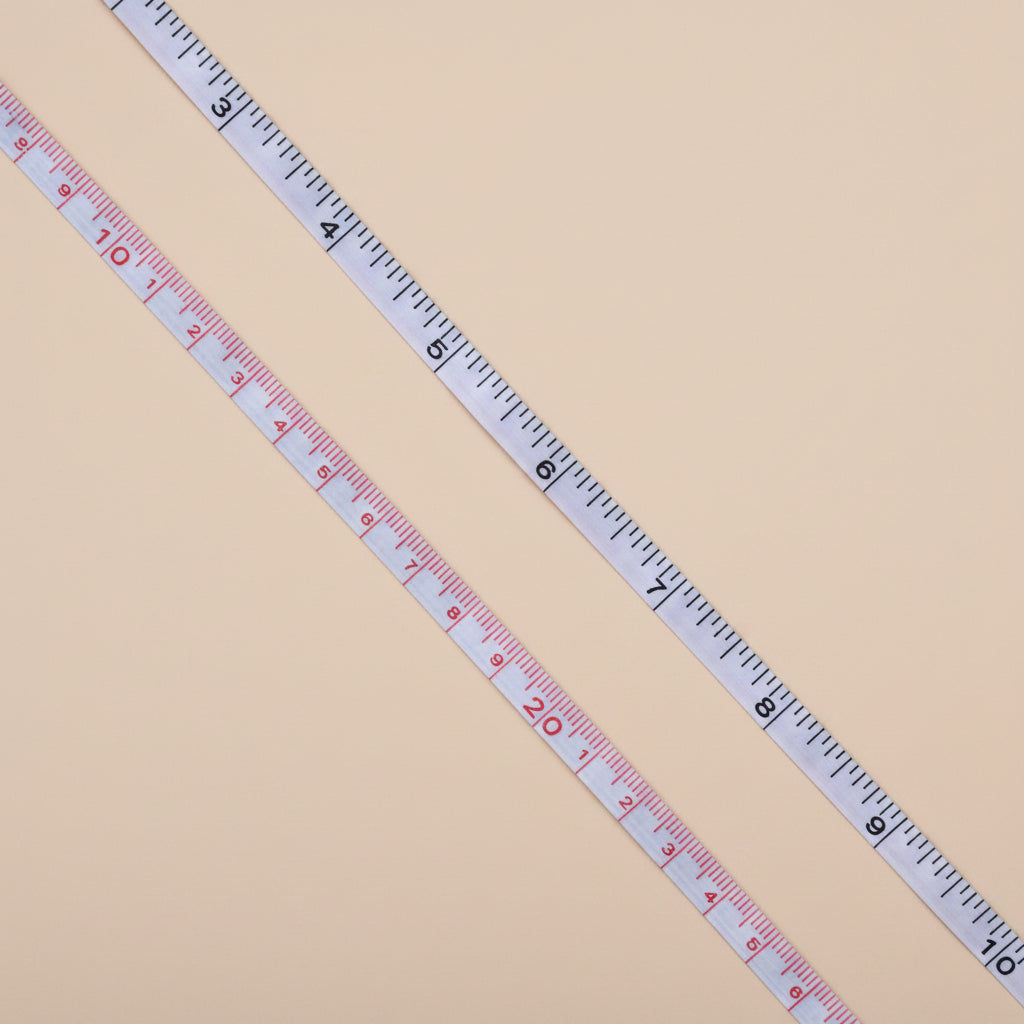 Measuring tape on a concrete surface