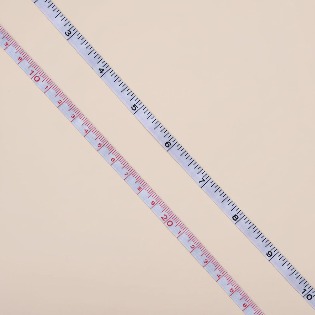 Measuring tape on a concrete surface