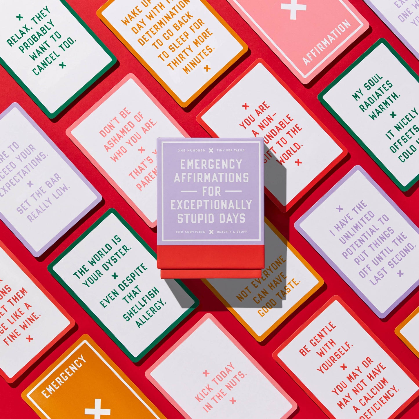 Open box showing several witty affirmation cards fanned out