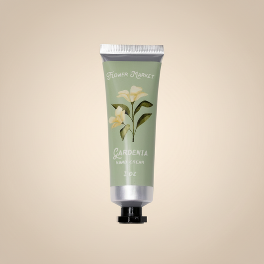 Hand cream tube with floral design on a white background