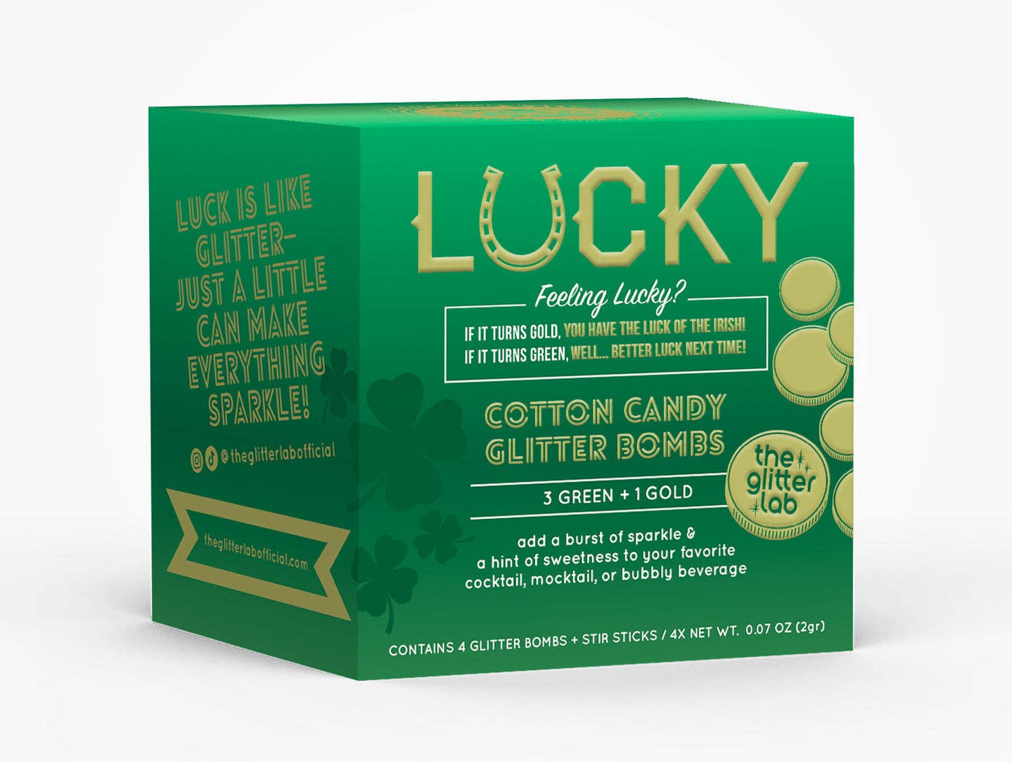 Box of Lucky Glitter Bombs with a mix of gold and green pouches and stir sticks, ready to add some luck to your drinks.