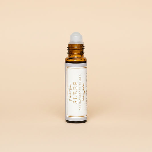 Roll-on bottle labeled 'Sleep' on a white background