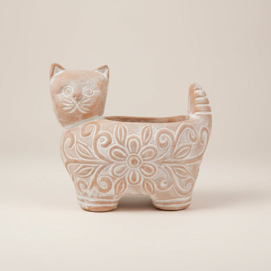 Cat-shaped ceramic planter with floral patterns on a white background