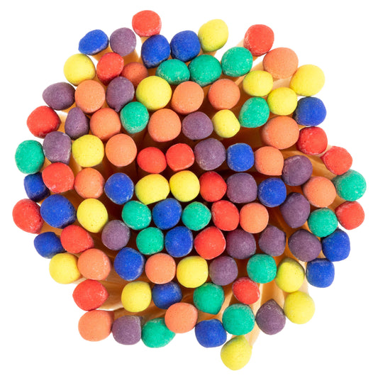 Rainbow-colored wooden matchsticks in a corked glass vial – vibrant matches perfect for candles, wedding favors, and gifts. Close up image of match sticks.