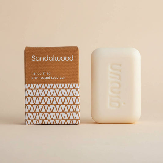 Sandalwood handcrafted plant-based soap bar with packaging on a white background