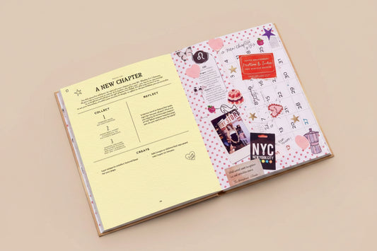 Open book with a calendar page and decorative elements on a pink background