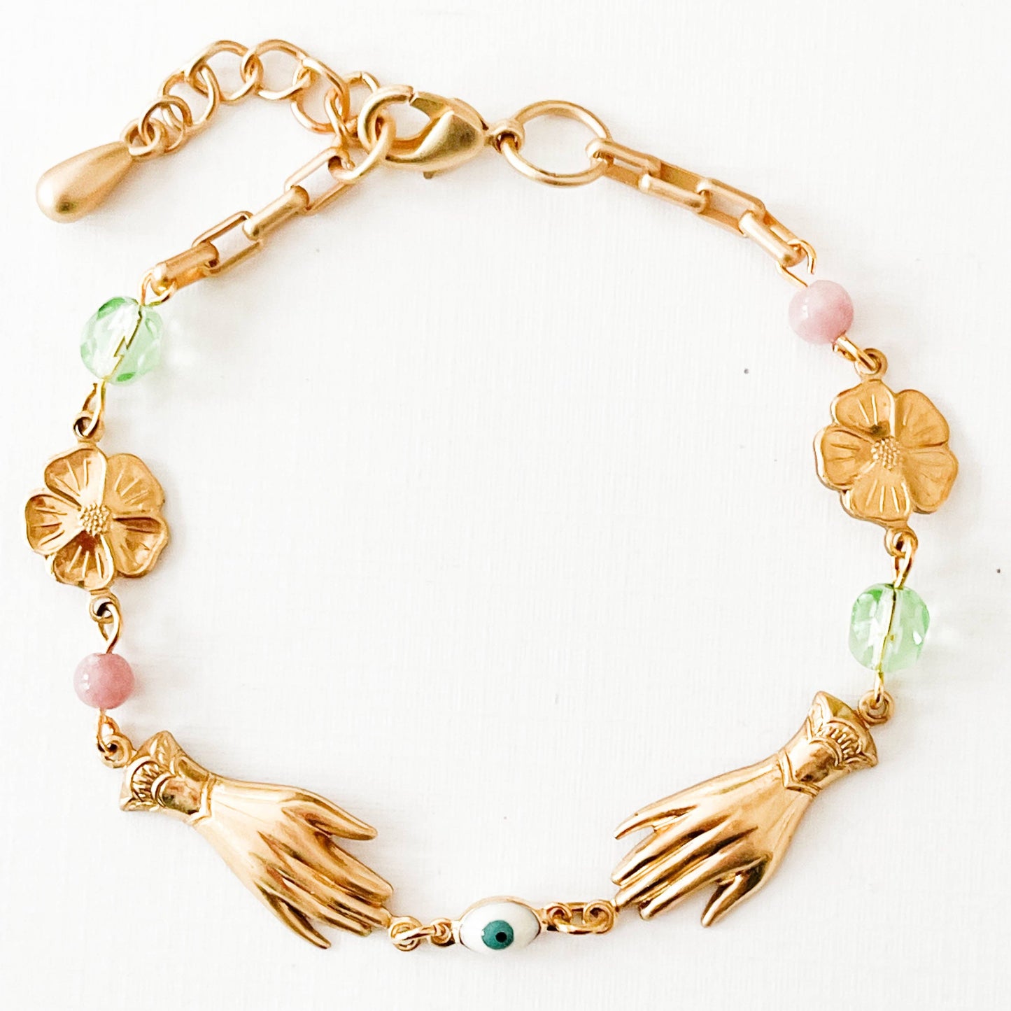 Handmade jewelry flat lay with springtime accessories and floral props