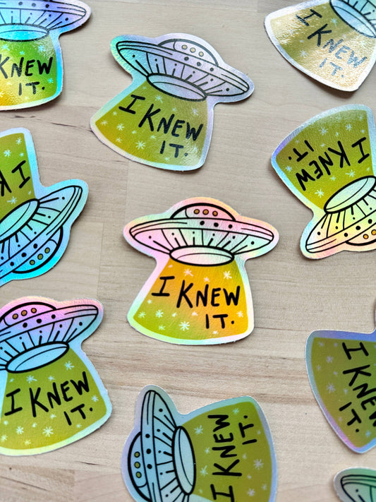 Close-up of 'I Knew It' flying saucer sticker design