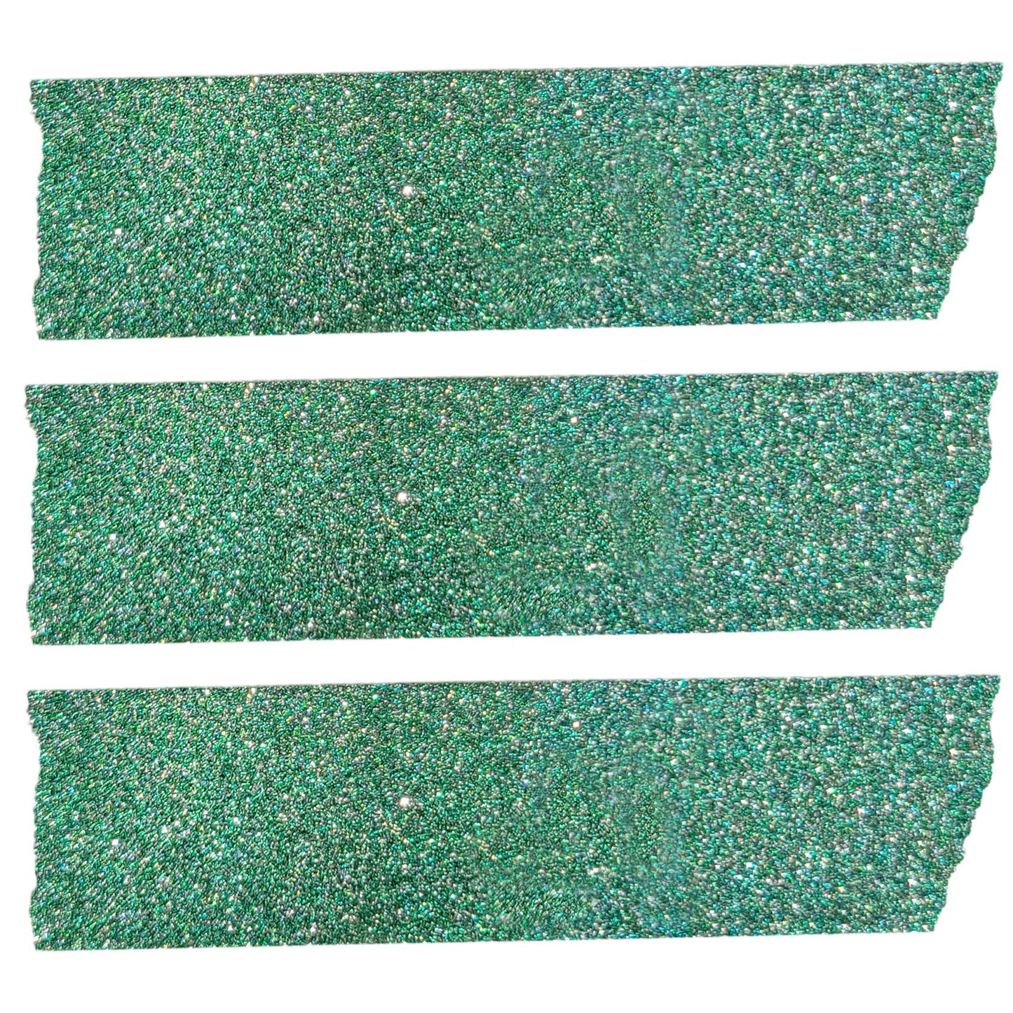 Close up view of three strips of the glittery green washi craft tape