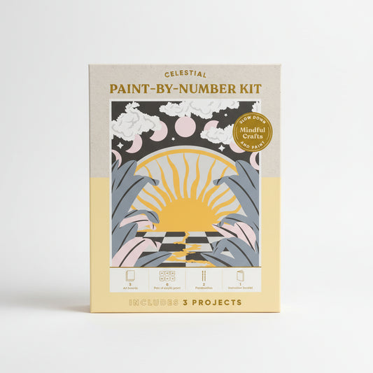 Celestial paint-by-number kit packaging with sun and moon design on a beige background