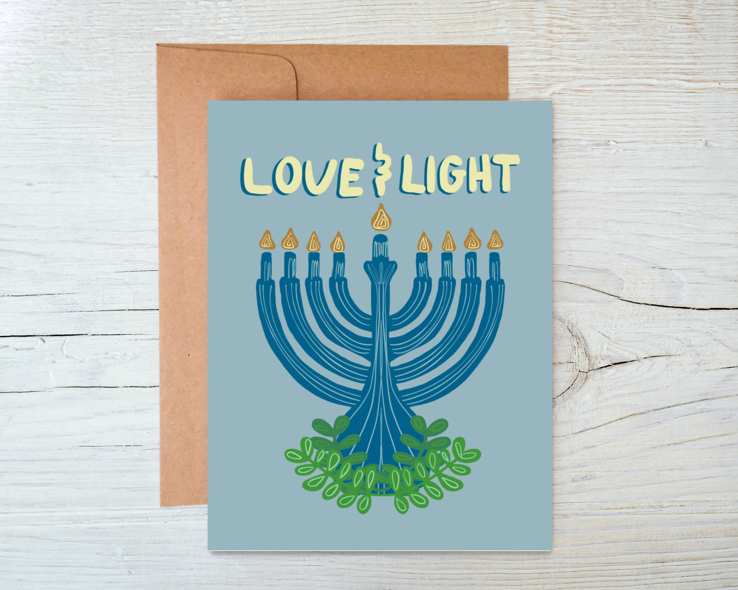 Hanukkah greeting card with glowing menorah design and elegant script