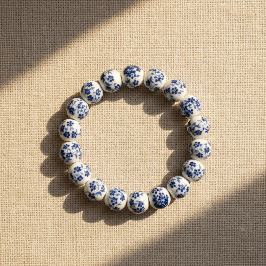 Bracelet with blue floral pattern on a textured beige fabric