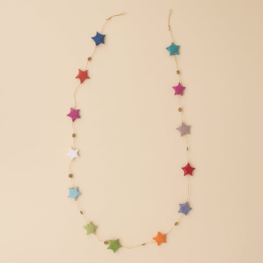 Close-up of rainbow paper stars with fine handmade texture
