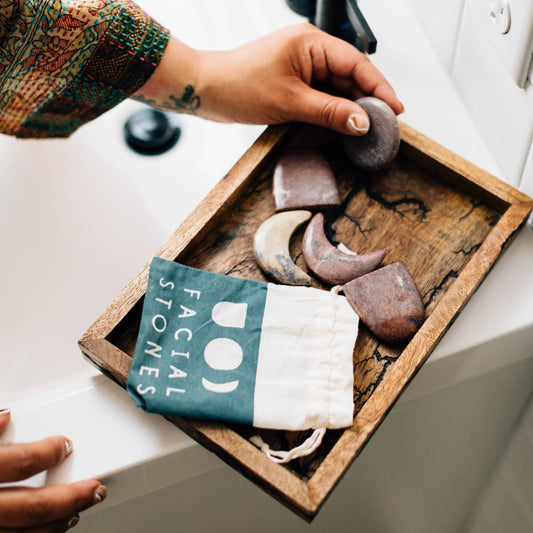 Garora stone set styled on a vanity with skincare essentials