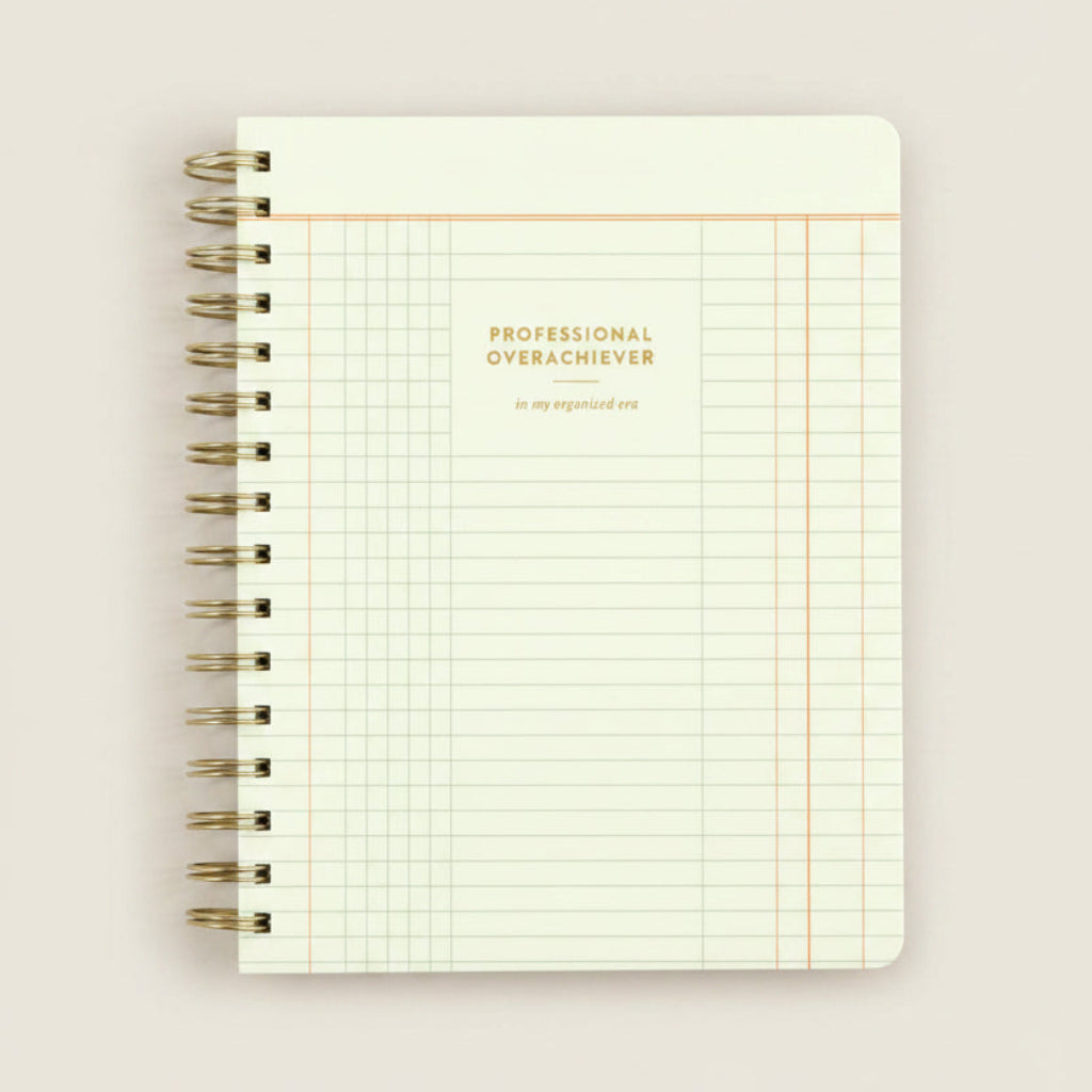 Notebook with grid pattern and 'Professional Overachiever' text on a white background