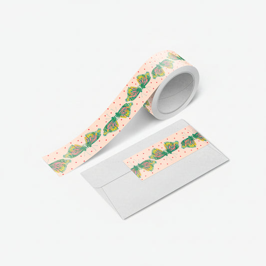 Close-up of monarch butterfly washi tape unspooled with vivid orange wings