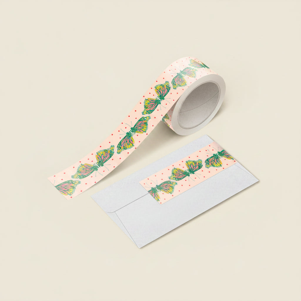 Close-up of monarch butterfly washi tape unspooled with vivid orange wings