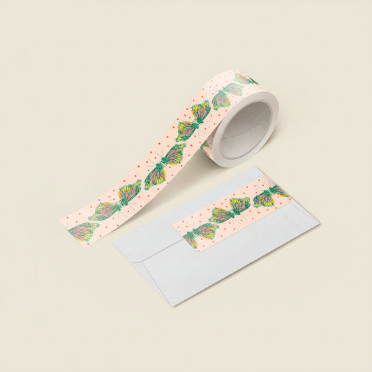 Close-up of monarch butterfly washi tape unspooled with vivid orange wings