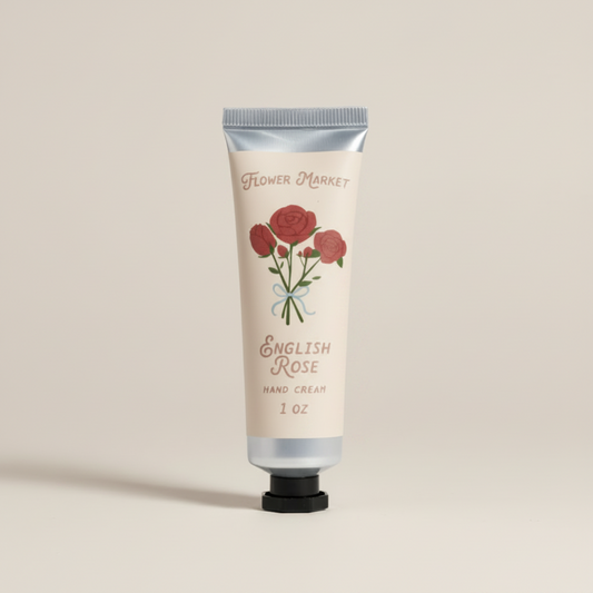 Hand cream tube labeled 'English Rose' with floral design on a white background