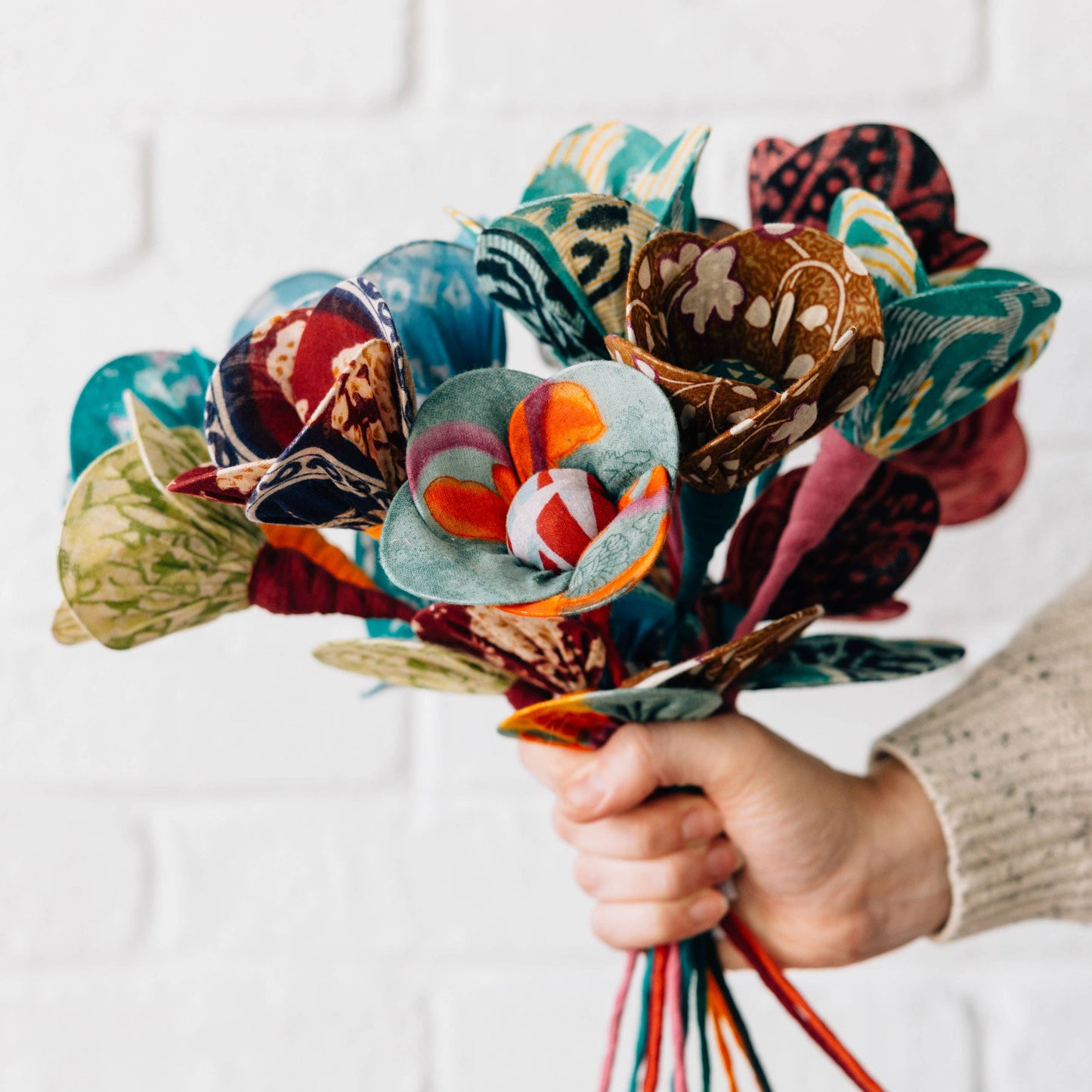 Close-up of handcrafted fabric petals with stitched details