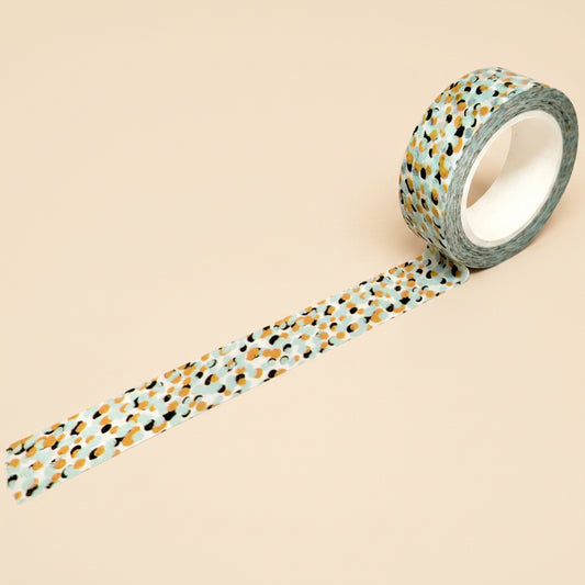 Roll of decorative tape with a pattern on a white background