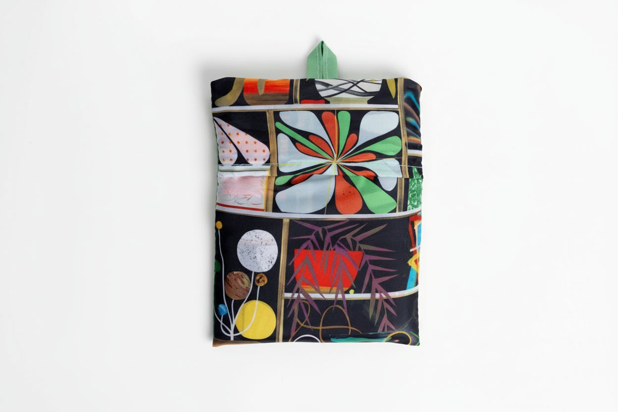 Eco-friendly Bodega Art Sack® folding into a compact pouch the size of 4.5 x 5.75 inches for easy storage and portability.