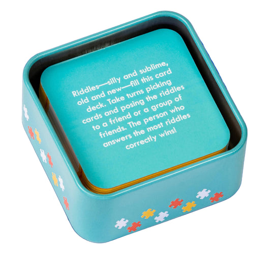Blue card game box with puzzle piece designs on a white background