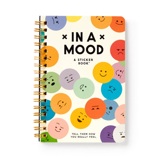 Sticker book with colorful emoji-style faces on a white background