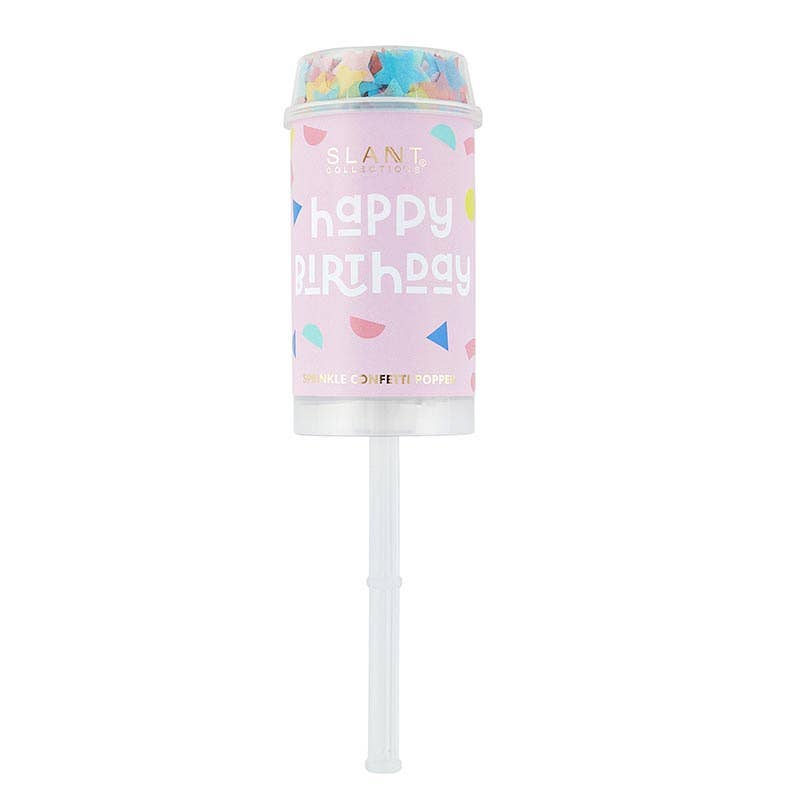 A colorful Happy Birthday party popper filled with confetti, with a white stick attached for popping.