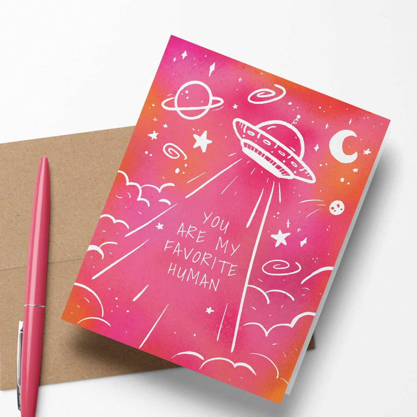 UFO-themed greeting card with the message "You Are My Favorite Human," featuring a blank interior, Kraft paper envelope, and high-quality matte finish.