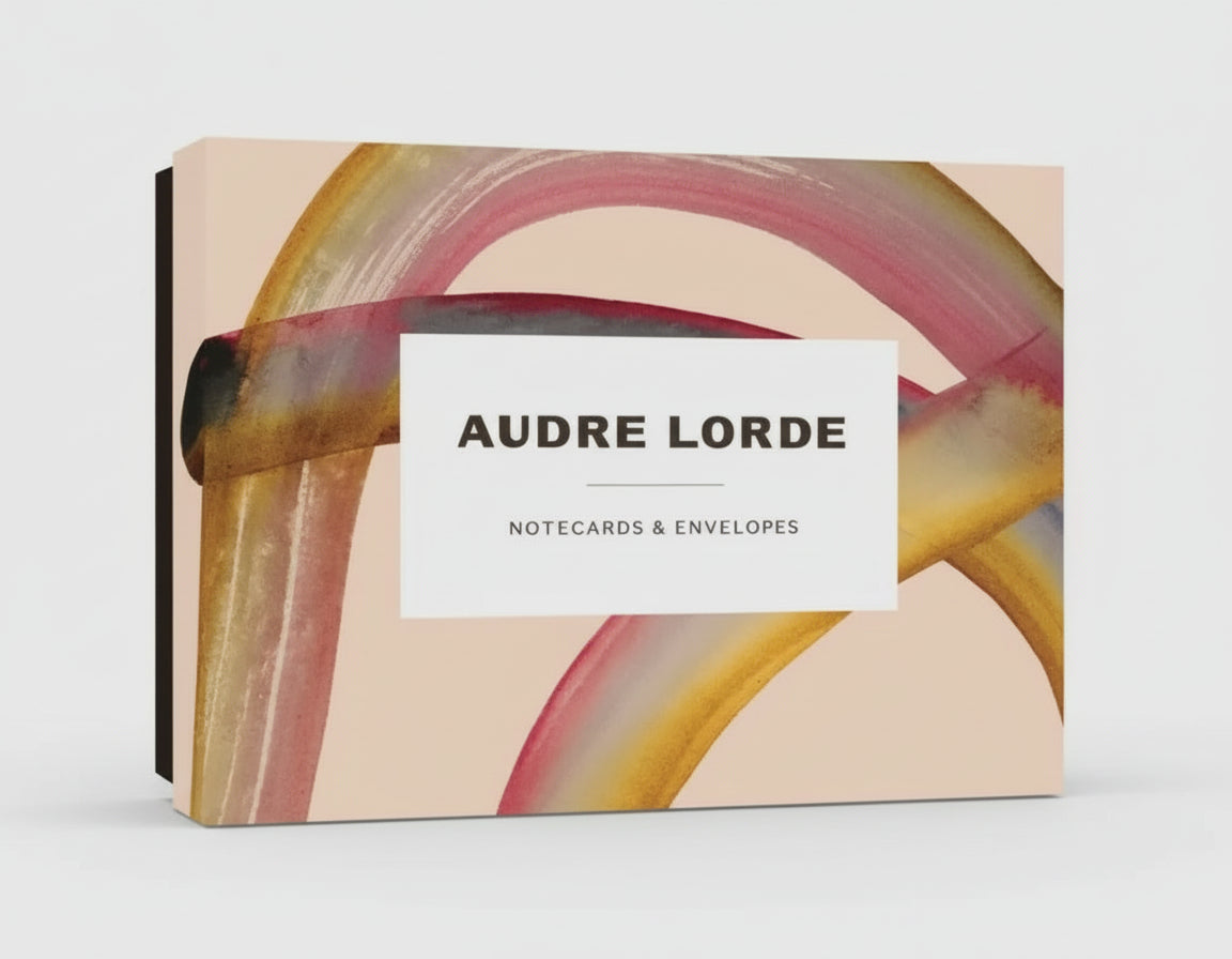 Audre Lorde notecards and envelopes fanned out to show quotes and vibrant designs