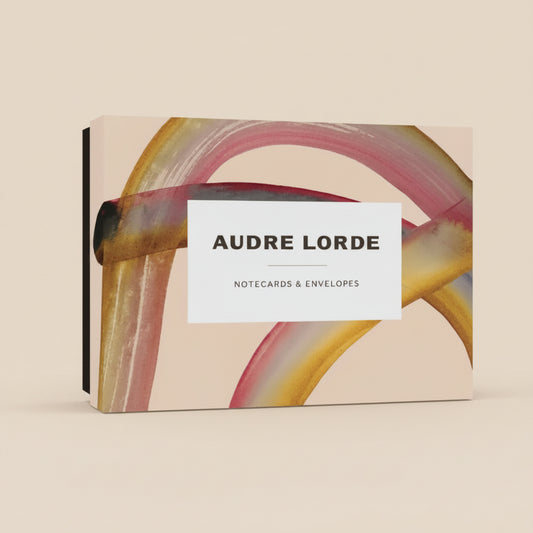 Audre Lorde notecards and envelopes fanned out to show quotes and vibrant designs