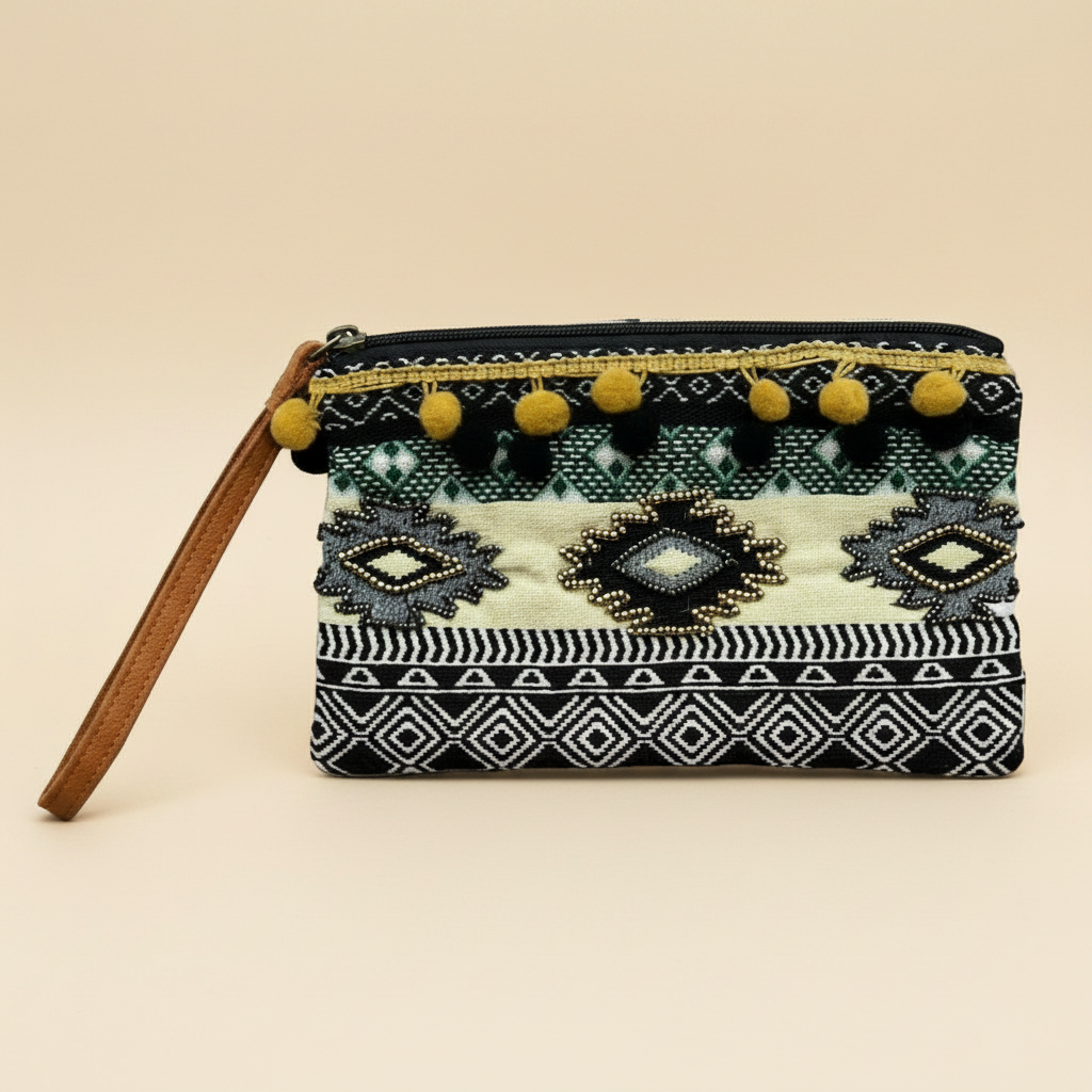 Multicolor wristlet with geometric shapes and little pom poms.