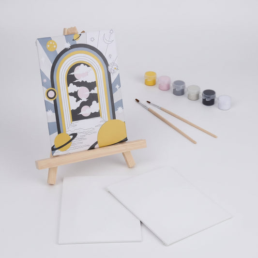 Painting set with canvas, paintbrushes, and paint containers on a white background