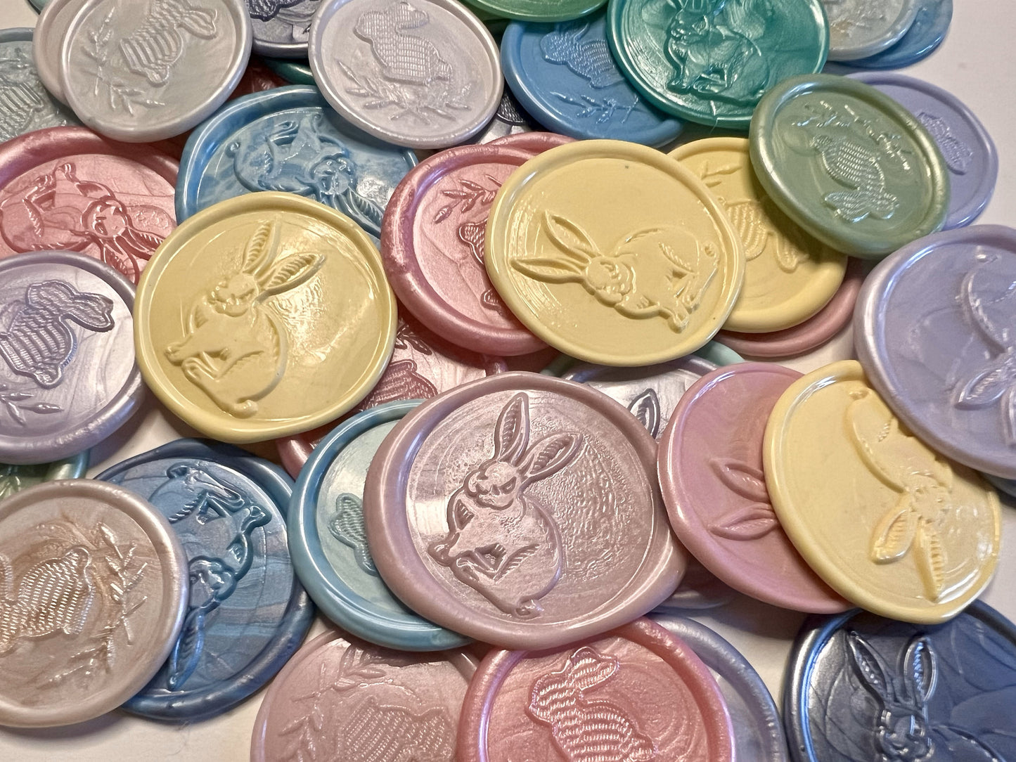 Vintage-style wax seal stickers featuring bunnies and florals in soft spring-inspired colors.