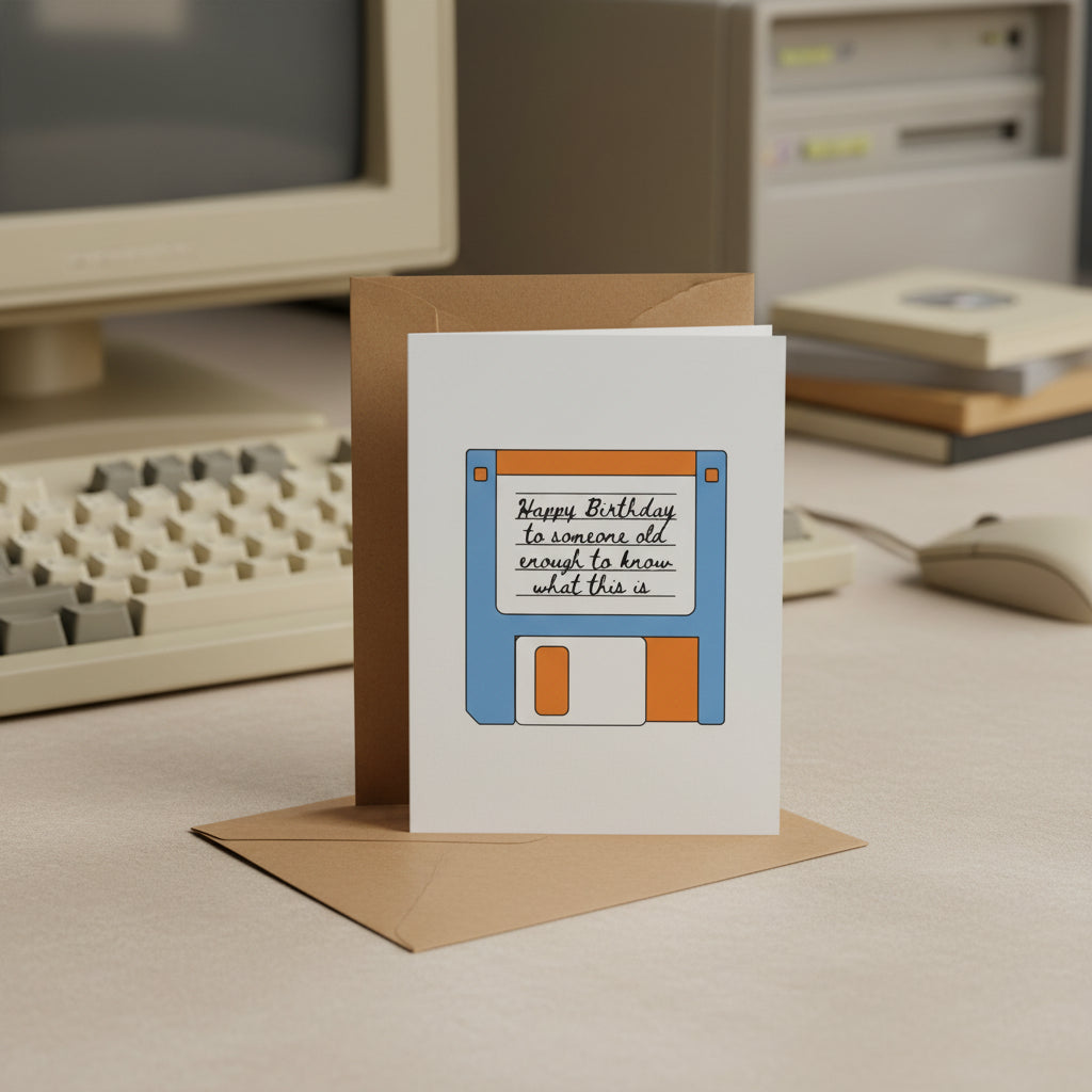 Greeting card with floppy disk design and birthday message, featuring a brown envelope.