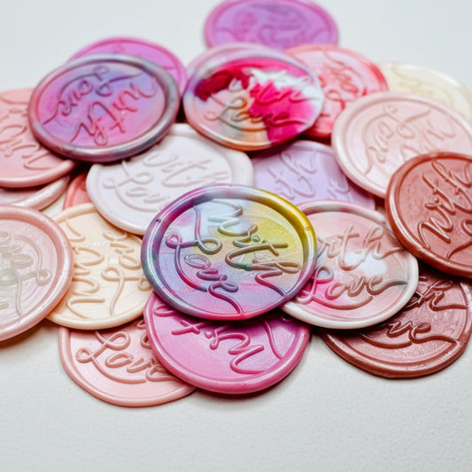 A close up view of the "With Love" wax seal stickers in the pink theme