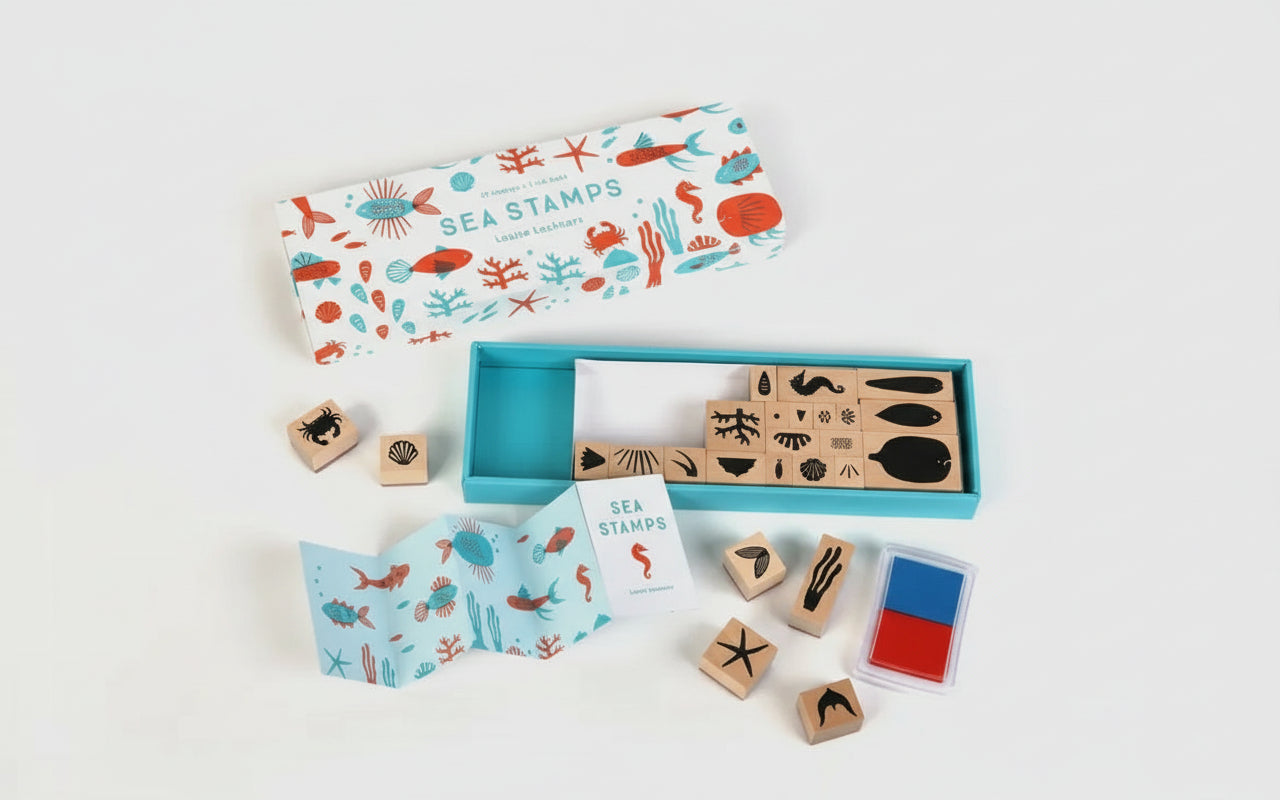 Assorted ocean-inspired stamps laid out, showcasing whimsical marine designs