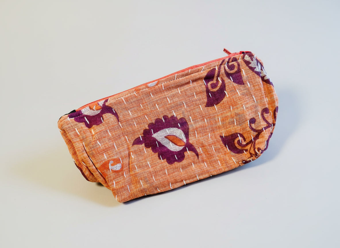 Medium size Kantha zippered pouch in various colors with floral designs.