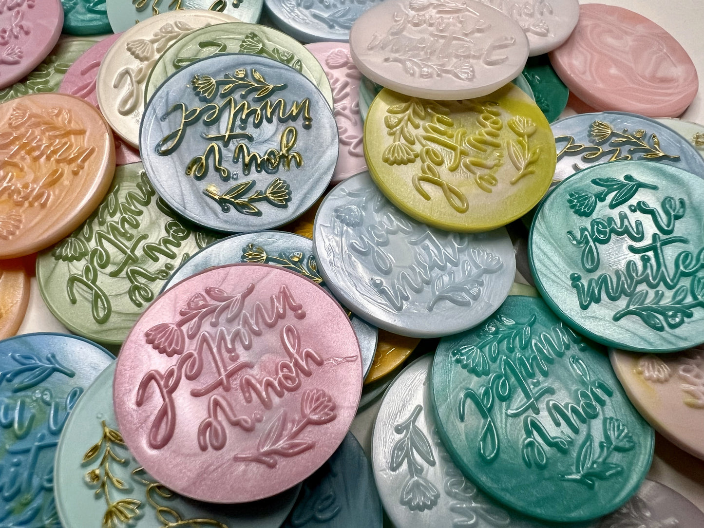 Make your invitations stand out with charming “You’re Invited” wax seals in assorted colors.