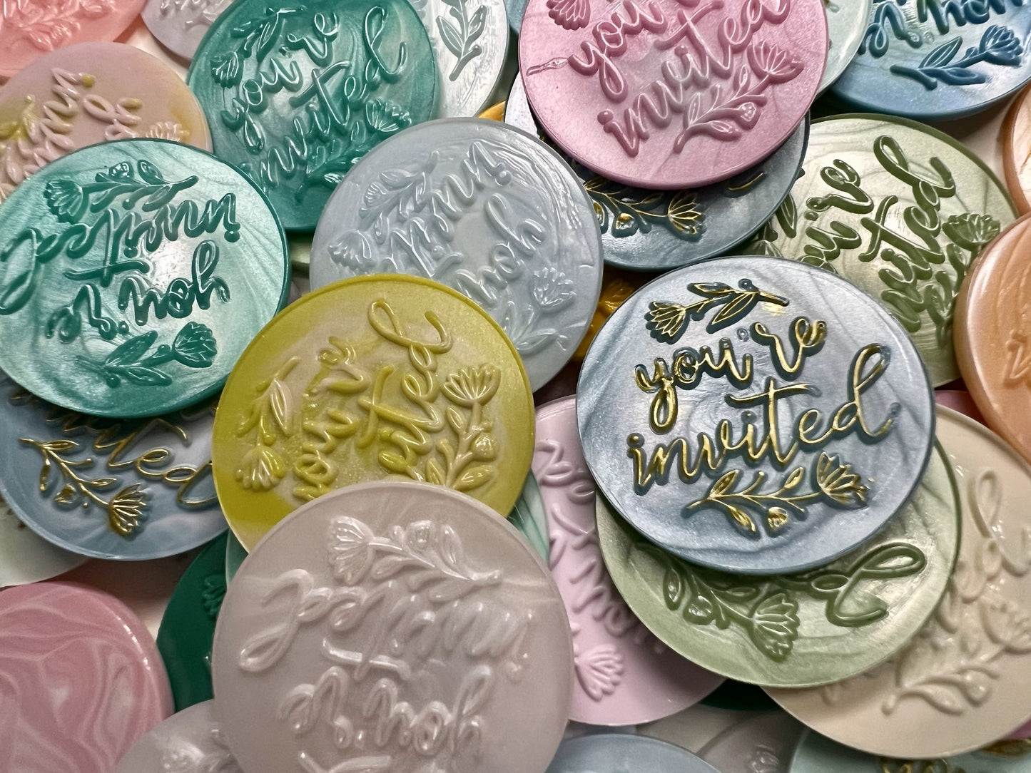 Handcrafted “You’re Invited” wax seals add a polished, personal touch to any party invitation.