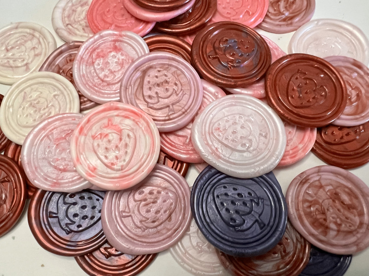 Handcrafted strawberry wax seal sticker made from beeswax-paraffin blend.