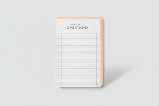 Notepad with grid lines and 'things I NEED to OVERTHINK' text on a white background