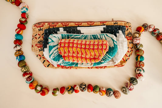 Colorful pouch with patterned contents on a white background