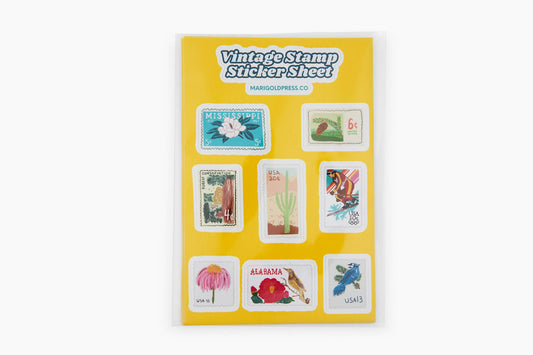 Close-up of floral and bird-themed postage stickers