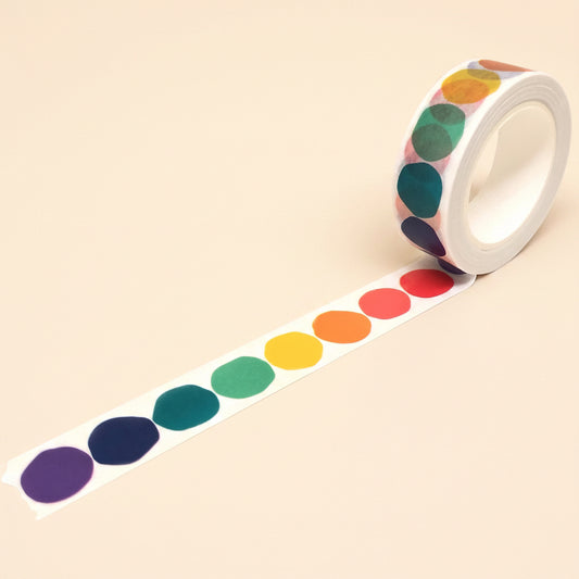 Roll of colorful Rainbow Dot washi tape on a white background