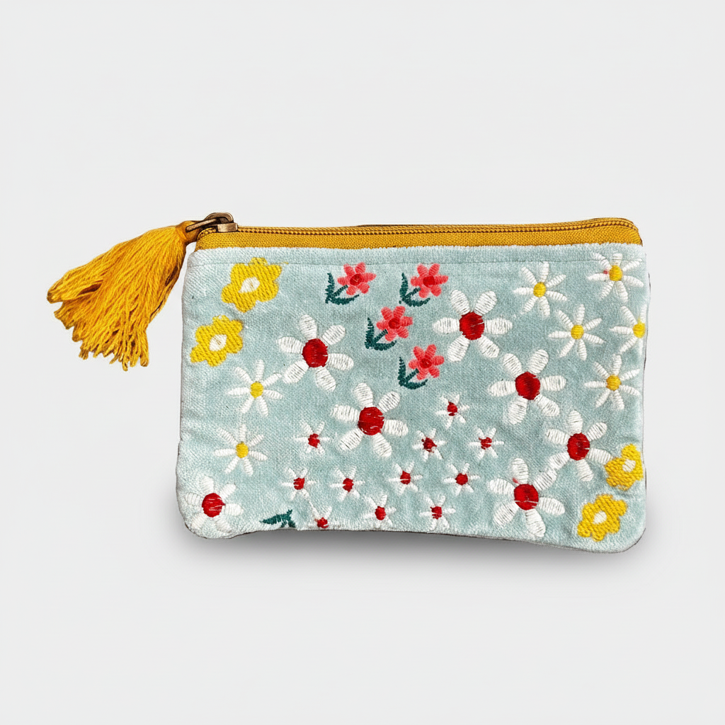 Floral-patterned pouch with a yellow tassel on a white background
